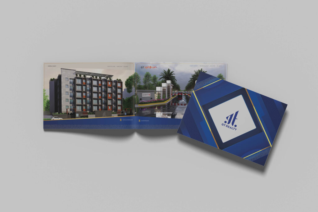 Brochure mockup for GT Realty, featuring a modern, professional design with a vibrant blue and gold theme. The open spread showcases high-quality 3D architectural renders of residential projects, while the cover highlights the company's logo in a sleek, geometric pattern. Ideal for companies seeking the best printing service in Chennai for premium real estate marketing materials.