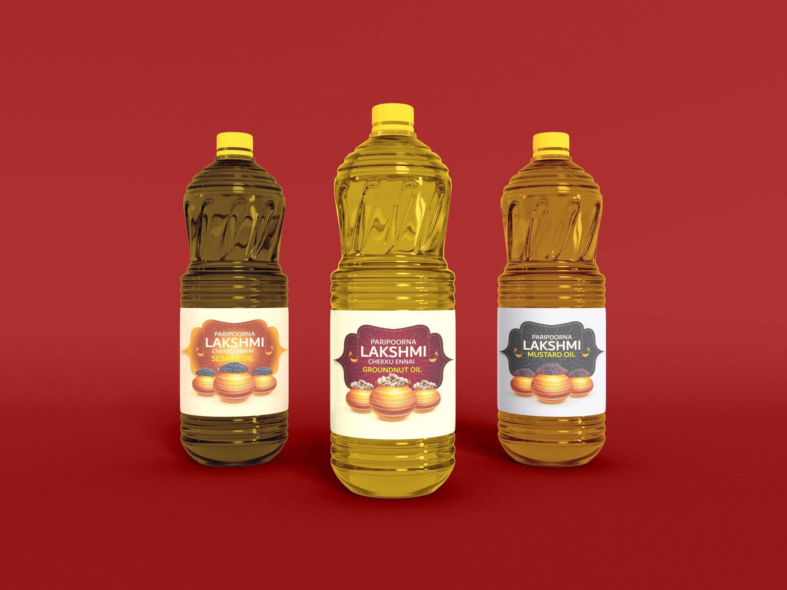 Package design for three plastic bottles of cooking oil with yellow caps, arranged side by side. Each bottle has a label that reads "Parabrahma Lakshmi". The labels indicate different varieties of oil including Groundnut and Mustard oil. The background is red.