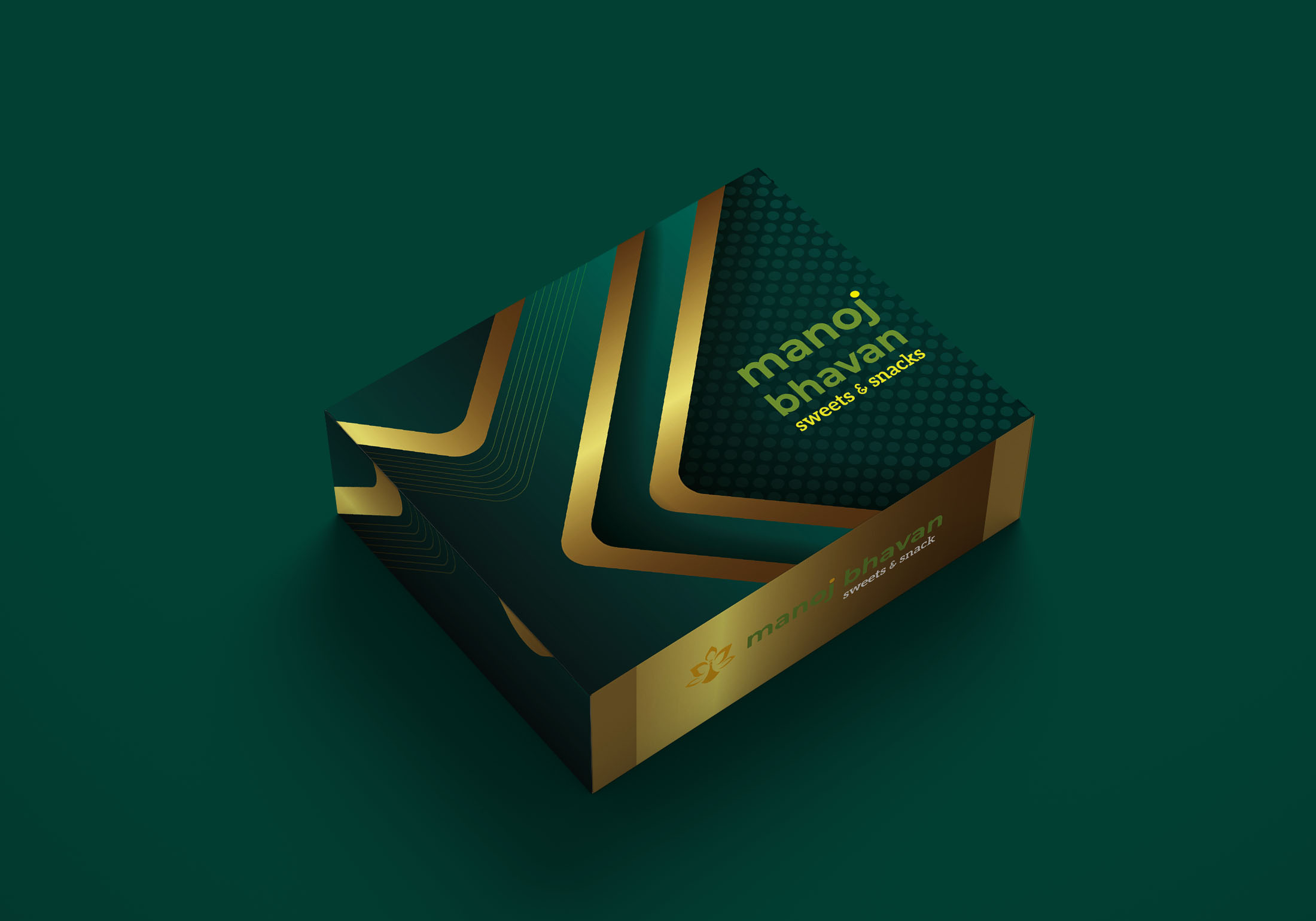 A dark green box with gold accents and geometric patterns, featuring the text "manoj bhavan" and "sweets & snacks" in yellow. The minimalist design is set against a matching green background.