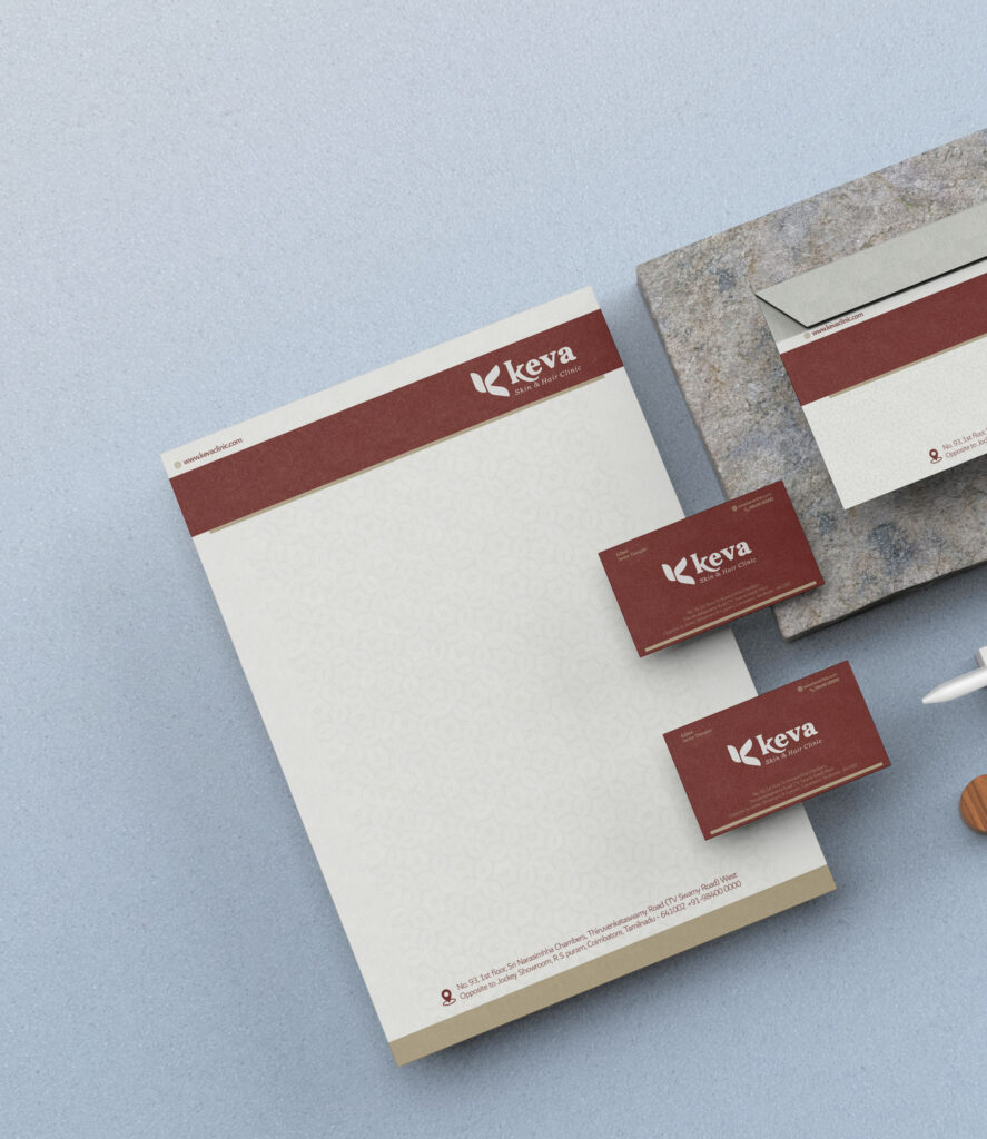 Professional letterhead and business card mockup featuring clean and elegant designs for Keva Skin & Hair Clinic, showcasing the precision and quality offered by the best printing service in Chennai. The set includes a branded letterhead, business cards, and an envelope, all printed in rich maroon and beige tones with detailed textures, demonstrating high-end print production ideal for corporate identity materials.